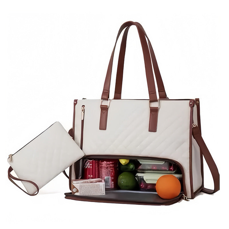 White lunch tote bag with brown straps filled with baby items on a white background