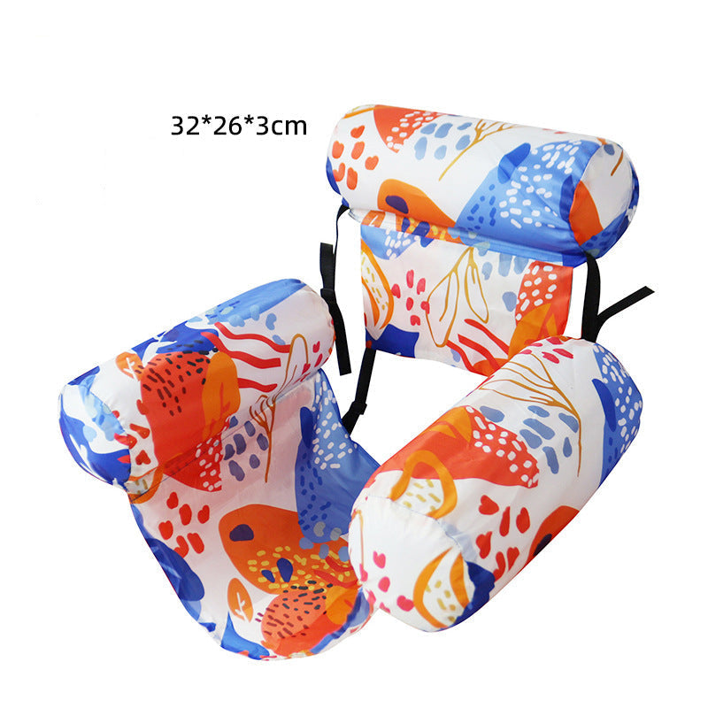 Colorful inflatable pool float with floral pattern on a white background