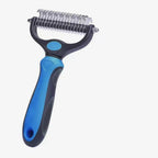 Pet grooming tool with blue handle and metal comb on a white background