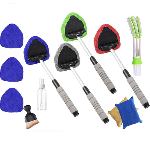 Set of cleaning brushes with different colored pads and handles on a white background.