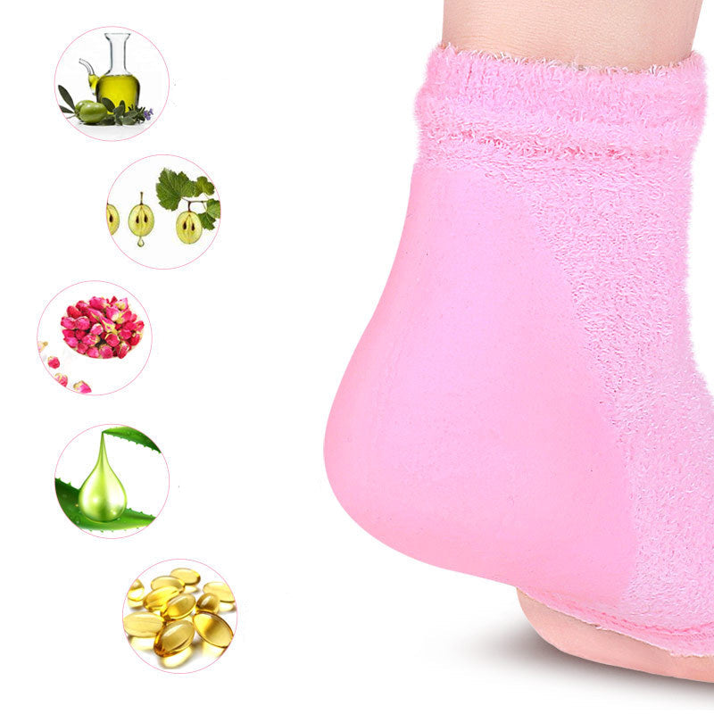 Close-up of a foot wearing a pink towel with cosmetic ingredients displayed.
