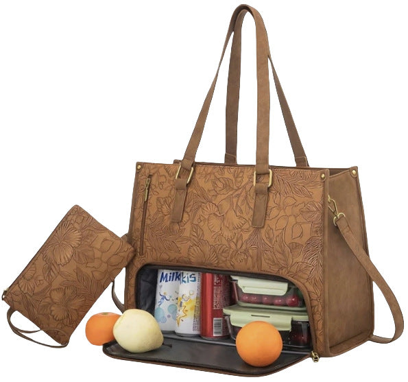 Brown leather lunch tote handbag with floral patterns, open to reveal items including a milk carton and oranges.