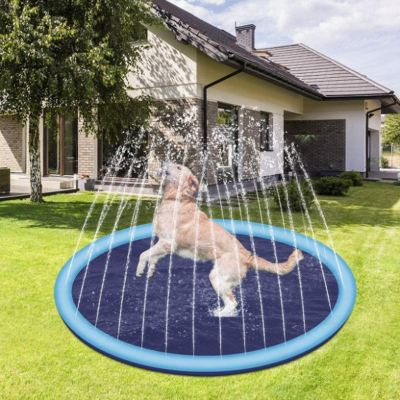 Dog playing in a inflatable water pad on a grassy lawn with a house in the background